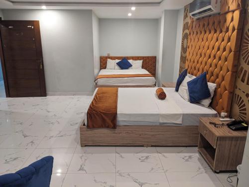 Кровать или кровати в номере Nuva Hotel