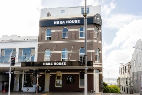 a building with a clock on the top of it at Haka House Auckland K'Road in Auckland