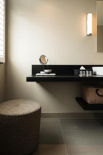 a mirror sitting on a shelf in a room at Boutique Hotel Beaumont Maastricht in Maastricht