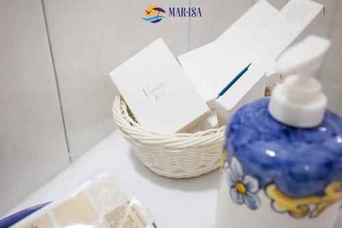a blue vase and a basket on a counter at MAR-ISA Amalfi Coast in Vietri sul Mare