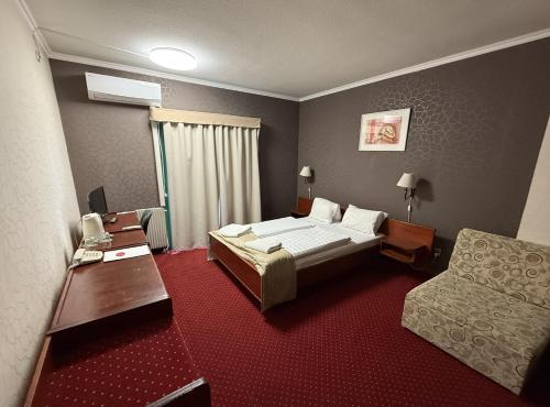 Postel nebo postele na pokoji v ubytování Hotel Amadeus