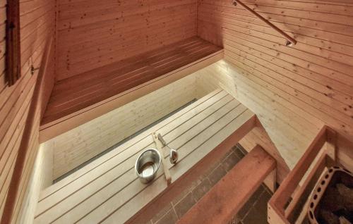 an inside view of a sauna with a sink at Beautiful Home In Berlevåg With Sauna in Berlevåg
