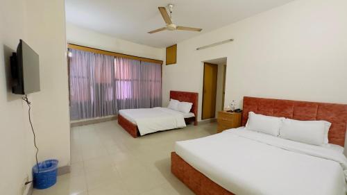 Hotel Dhaka City Innにあるベッド
