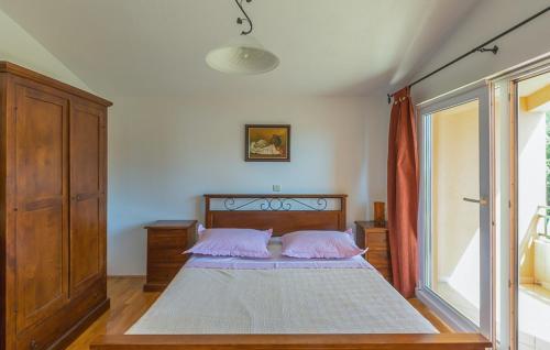 a bedroom with a bed and a large window at Apartman Tara - Makarska by Villas Guide in Makar