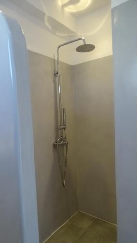 A bathroom at Hermes-Ios Rooms To Let