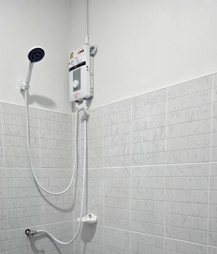 a shower in a bathroom with a shower at Route652 Resort Singburi in In Buri