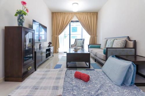 Μια τηλεόραση ή/και κέντρο ψυχαγωγίας στο Homely Suasana Suites Stay Cozy Comfort in JB