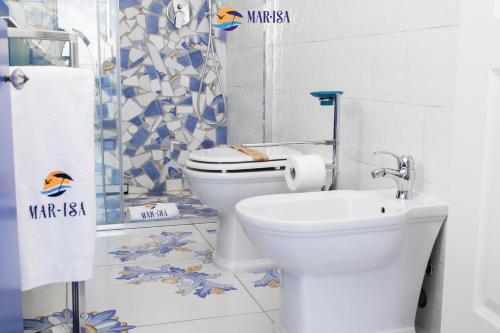 a bathroom with a toilet and a sink at MAR-ISA Amalfi Coast in Vietri sul Mare