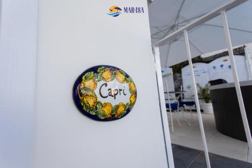 a sign on a white wall with a sign that says citt at MAR-ISA Amalfi Coast in Vietri sul Mare