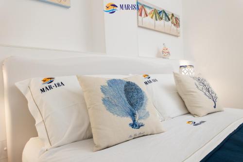 a white couch with pillows on top of it at MAR-ISA Amalfi Coast in Vietri sul Mare