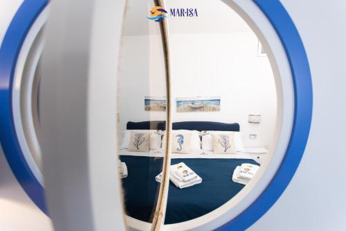 a reflection of a room with a bed in a mirror at MAR-ISA Amalfi Coast in Vietri sul Mare