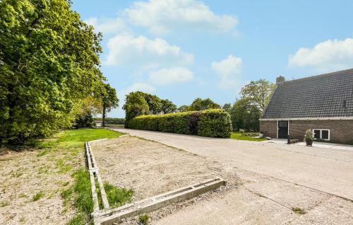 a dirt road in front of a house at Cozy Home In Harich With Wifi in Harich
