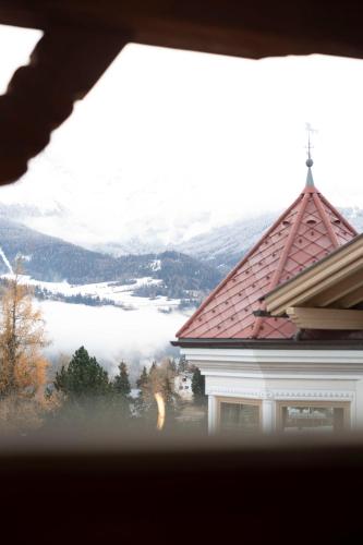 a view from a window of a building with a mountain at Chalet LAUDEGG in Ladis