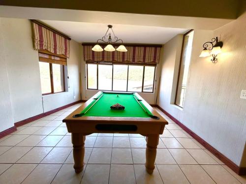 a room with a pool table in a house at Fish Eagle Bay 28, Warmbaths in Bela-Bela