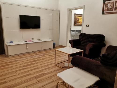 Μια τηλεόραση ή/και κέντρο ψυχαγωγίας στο جوهرة المصايف للشقق المخدومة الطائف