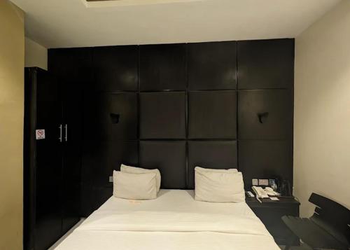 Voodi või voodid majutusasutuse Rosmohr Vintage Hotel & Suites toas