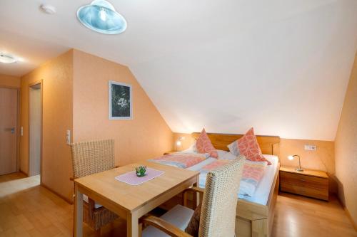 a living room with a table and a couch at Grundhof in Oberprechtal