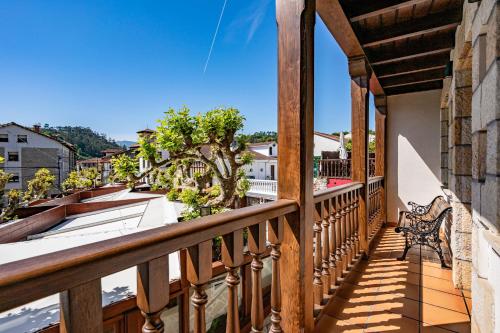 a balcony with a view of a city at Apartamentos El Rincón de Bustio in Bustio