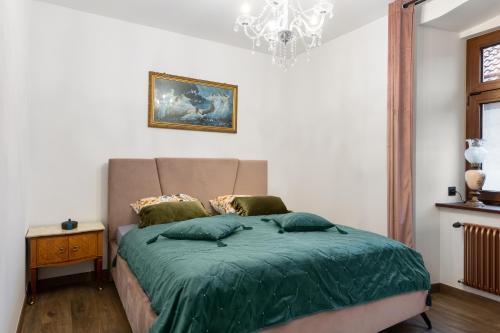 Ένα ή περισσότερα κρεβάτια σε δωμάτιο στο Apartament Rozalia