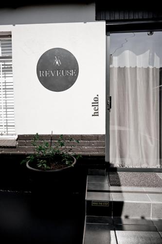 a door with a sign that reads kyrusrtrust at Reveuse in Pretoria