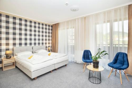 Postel nebo postele na pokoji v ubytování Instytut Zdrowia Sofra FIT & SPA