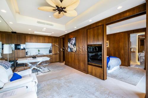 a living room with wood paneling and a ceiling at Villa Sunset by EvTatilim Bodrum, Yalikavak in Bodrum City