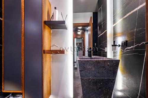 a bathroom with a sink and a mirror at Villa Sunset by EvTatilim Bodrum, Yalikavak in Bodrum City