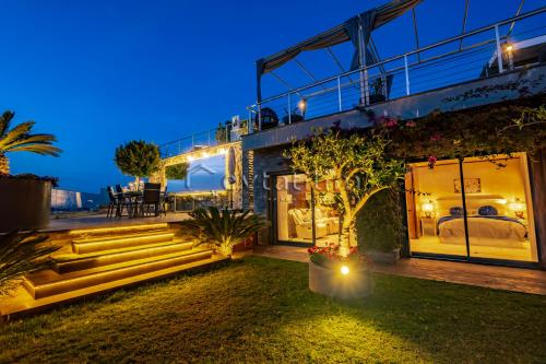 a house with stairs leading up to a bedroom at Villa Sunset by EvTatilim Bodrum, Yalikavak in Bodrum City