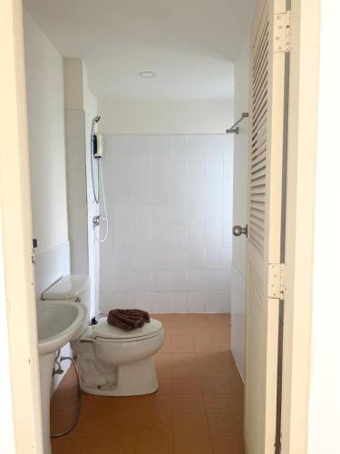 a bathroom with a toilet and a sink at Phangan Utopia Resort in Mae Haad