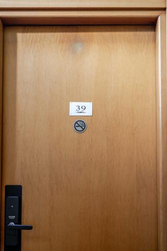 a sign on a door with the number on it at Hotel POSTA - 2 stars - Comfortable Stay in Ventimiglia in Ventimiglia