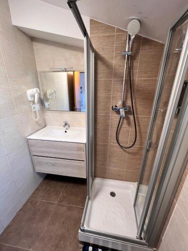 a bathroom with a shower and a sink at MT Boutique Suites y Apartamentos - Adults Only - in Mataró