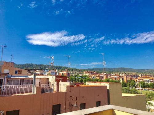 a view of a city from the roof of a building at MT Boutique Suites y Apartamentos - Adults Only - in Mataró