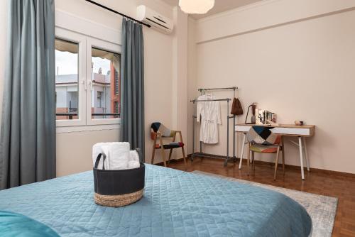 a bedroom with a bed and a table and chairs at Aegealis Stay in Samos