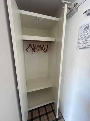 a walk in closet with shelves and hangers at Cookson Room in Haydon Bridge