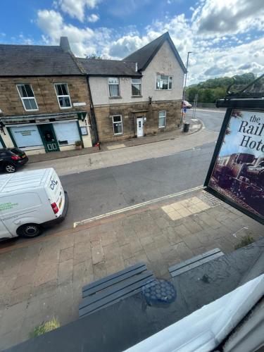 a view from a window of a street with a van at Cookson Room in Haydon Bridge