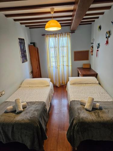 Ένα ή περισσότερα κρεβάτια σε δωμάτιο στο Casa do mestre hio