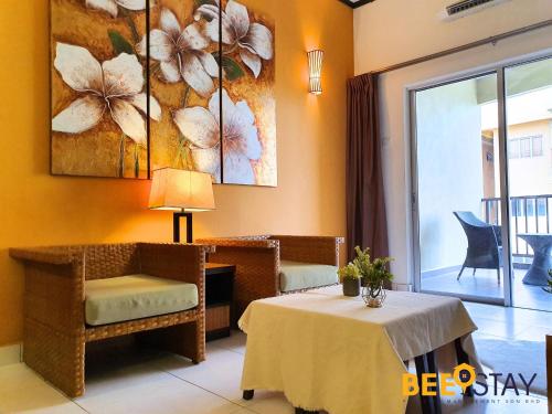 a room with a table and a chair and a window at Gold Coast Morib Studio l Apartment I Penthouse in Banting