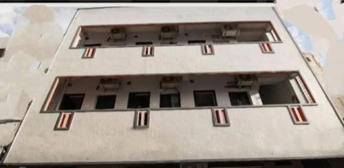 an aerial view of a white building with windows at Chhatrapati Residency Tirupati in Tirupati