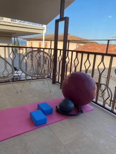 a group of exercises on a yoga mat on a balcony at Casa Moniga 2-Residenze Lizzeri in Moniga