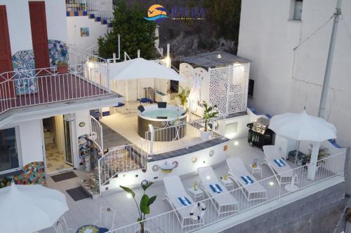 an aerial view of a patio with chairs and umbrellas at MAR-ISA Amalfi Coast in Vietri sul Mare