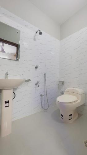 Ένα μπάνιο στο Hotel Sunrise Residential
