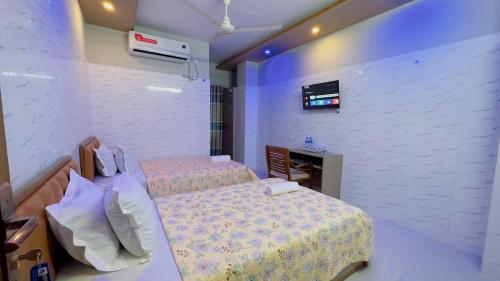 Ένα ή περισσότερα κρεβάτια σε δωμάτιο στο Hotel Sunrise Residential