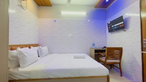 Ένα ή περισσότερα κρεβάτια σε δωμάτιο στο Hotel Sunrise Residential