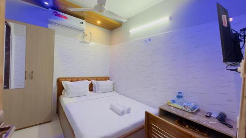 Ένα ή περισσότερα κρεβάτια σε δωμάτιο στο Hotel Sunrise Residential