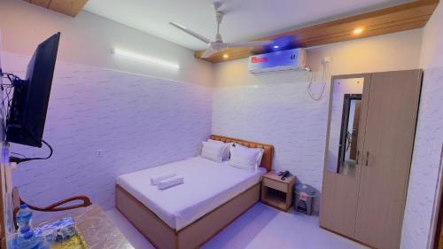 Ένα ή περισσότερα κρεβάτια σε δωμάτιο στο Hotel Sunrise Residential