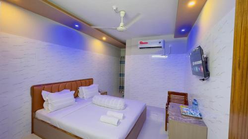 Ένα ή περισσότερα κρεβάτια σε δωμάτιο στο Hotel Sunrise Residential