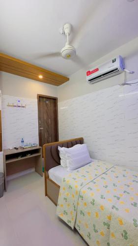 Ένα ή περισσότερα κρεβάτια σε δωμάτιο στο Hotel Sunrise Residential