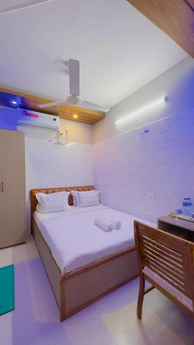 Ένα ή περισσότερα κρεβάτια σε δωμάτιο στο Hotel Sunrise Residential