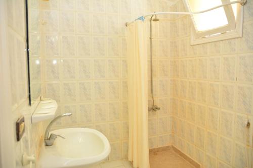 Phòng tắm tại Apartment Empire Hotel