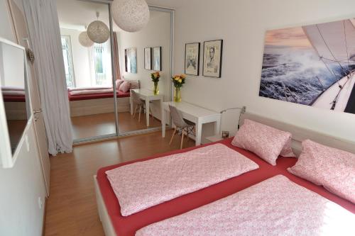 a bedroom with a bed and a dining room at Romantika na jezeře in Staré Splavy